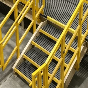Yellow fiberglass anti-slip stair nosing on industrial FRP grating steps