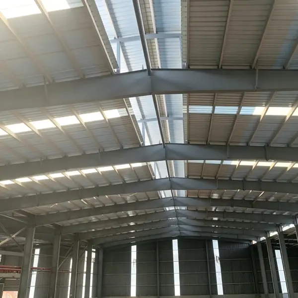 Bright yellow pultruded FRP fiberglass purlins under installation at construction site, high strength fiberglass purlin beams for industrial roof framing - Mingchi FRP