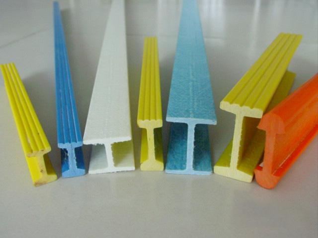Various colored fiberglass reinforced plastic FRP structural profiles including I-beams