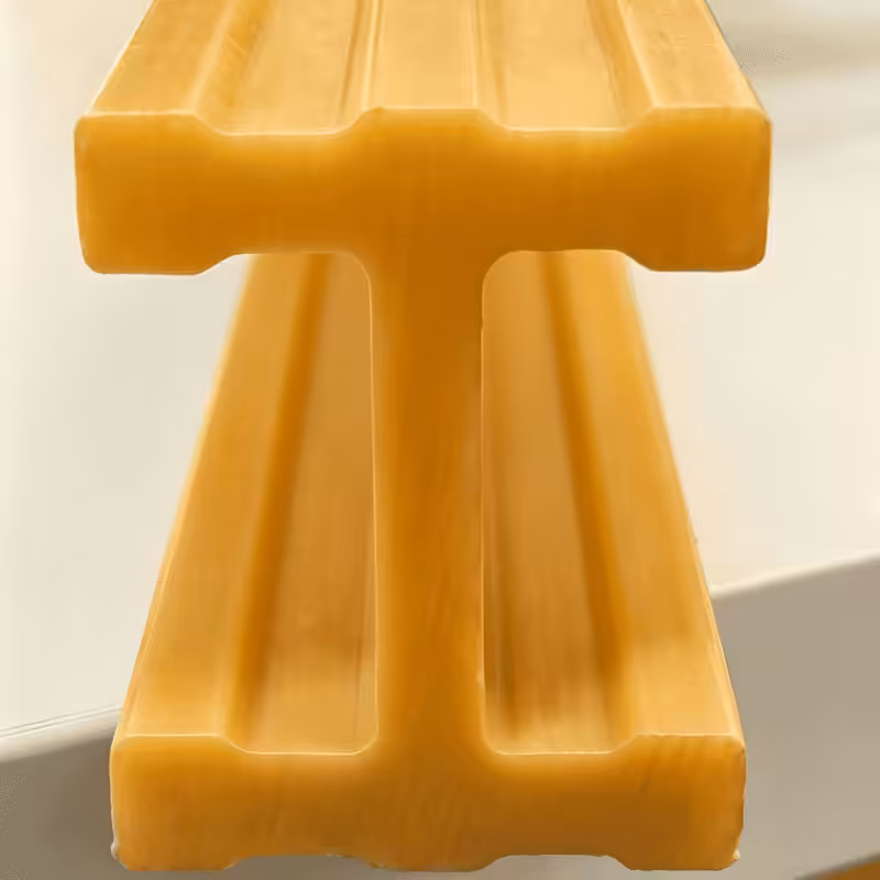 Yellow safety-rated FRP I-beam, high-visibility fiberglass structural beam for walkway support in corrosive environments