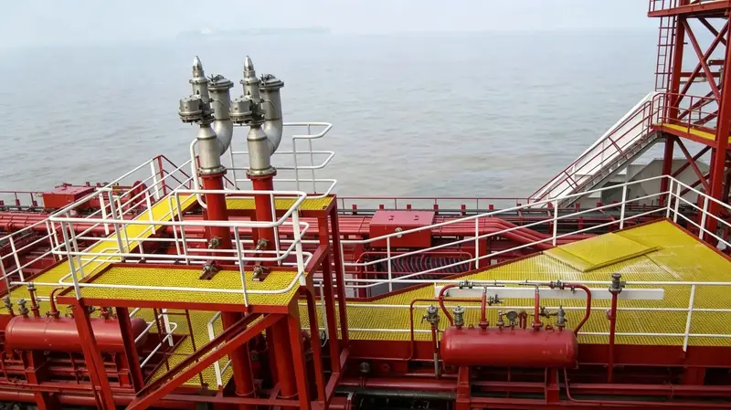 Yellow anti-slip fiberglass grating installed on chemical ship deck with red piping