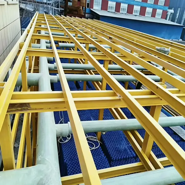 Yellow Mingchi FRP fiberglass support frame and piping installed in cooling tower