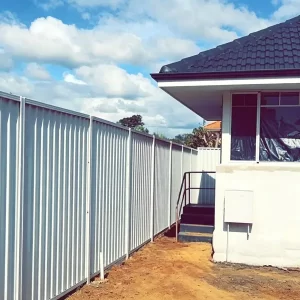 ALT="Pultruded FRP vertical rib wall panel installed as Australia backyard privacy fence near residential house"