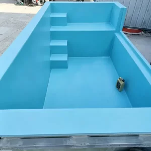 Blue fiberglass prefab swimming pool with straight inside steps