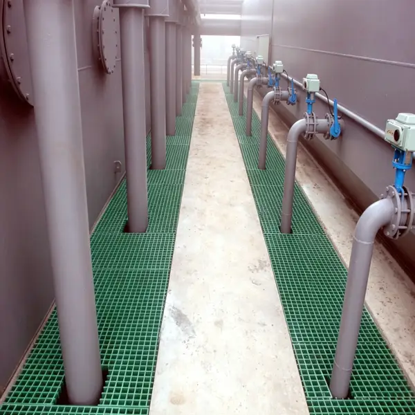 Green FRP fiberglass grating installed around chemical storage tank pipeline trench, anti-corrosion industrial walkway floor grating for chemical plant drainage pit