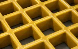 Close-up of yellow square mesh molded FRP grating