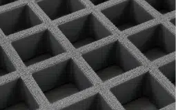 Close-up of gray grit-top molded FRP grating