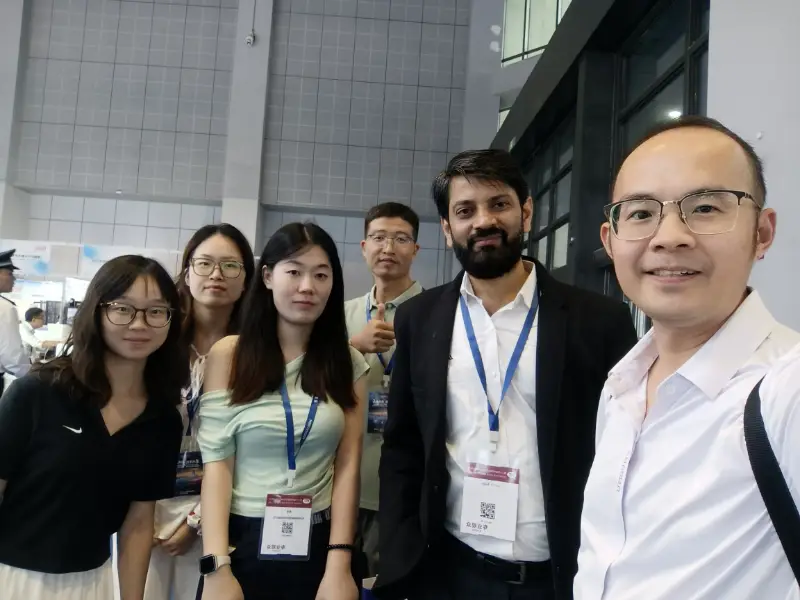 Mingchi FRP team and international industry partners at a composites exhibition